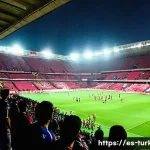 튀르키예의 주요 스포츠 경기장 - **Prompt 1: Passionate Turkish Football Stadium Atmosphere**
    "A vibrant, dynamic wide-angle shot...